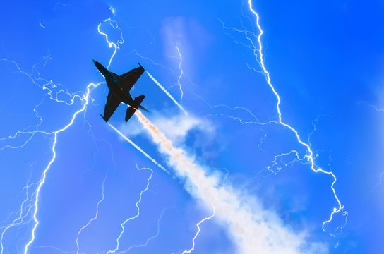 Combat fighter jet against the sky with lightning thunderstorms at night