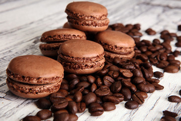 Sweet and colourful french macaroons or macaron with coffee