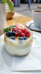 Fresh berries and cream mousse.Dessert in a jar