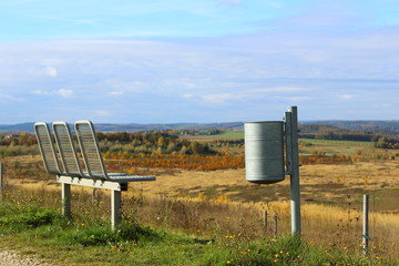 view from the schmirchau height near ronneburg, germany with bench and waste bin