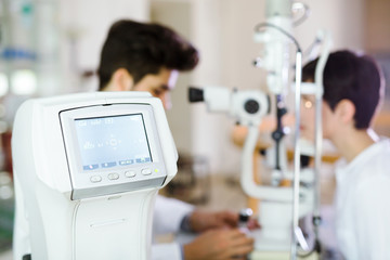 Girl woman in ophthalmology clinic for diopter detection