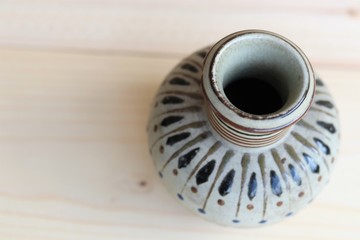 Empty vase on wood background 