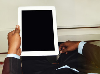 Hand holding blank tablet pc screen