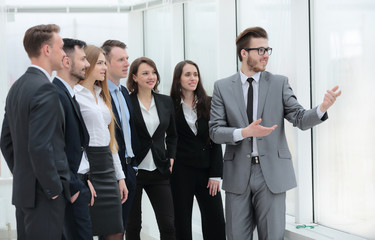 businessman and a group of young business people
