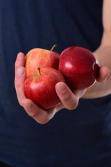 Apples trio on Tshirt background. Apples in bright juicy color