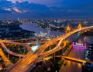 Fototapeta na wymiar Bangkok Expressway top view, Top view over the highway,expressway and motorway at night, Aerial view interchange of a city, Shot from drone, Expressway is an important infrastructure in Thailand
