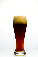 Glass of beer on white background