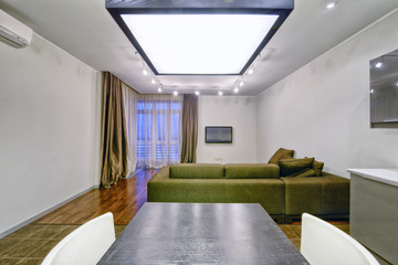 Interior of the kitchen-living room in a modern house.
