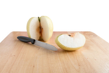 Peel chinese pear by knife on the wooden board on white background