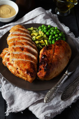 Fried spicy chicken fillet with salad and mustard