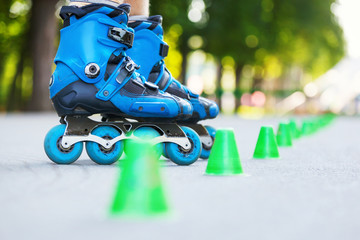 Inline roller skater on a slalom course