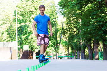 Inline roller skater on a slalom course