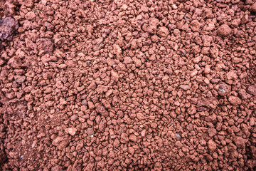 Texture of red stones of different size, brick color, Iceland