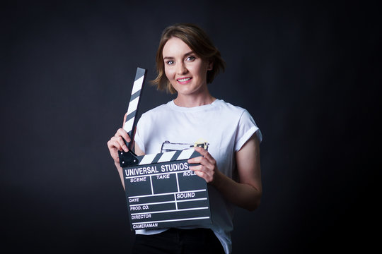 young girl with a clapperboard cinema