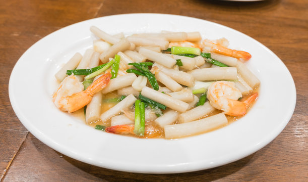 Stir-fried baby lotus root with shrimp on white dish,Thai food.