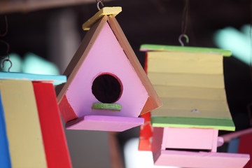 Obraz na płótnie Canvas colorful wooden bird house as background.