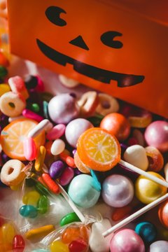 View of various sweet food by orange box