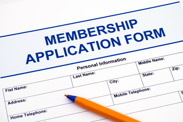 Membership application form with pen.