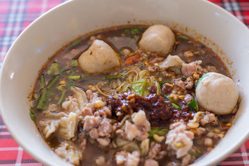 Spicy TOM YAM pork noodle soup with lemongrass, chilly pasted and lime juice