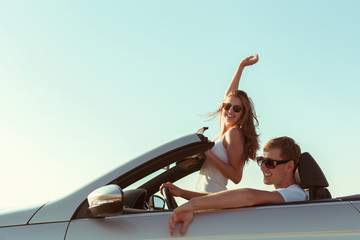 Young couple traveling by car
