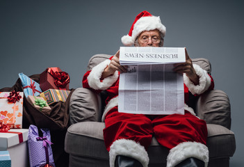 Santa Claus reading business news