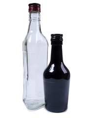 Empty glasses bottles on white background