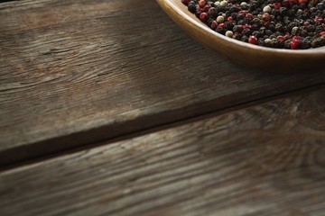 Mix peppercorns in wooden bowl
