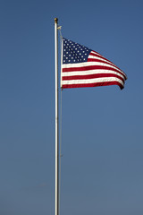Fototapeta premium American flag on the blue sky