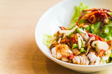 spicy squid with salad