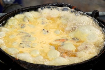 Crispy fried mussels with egg