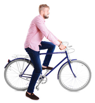 Young handsome man with bicycle on white background