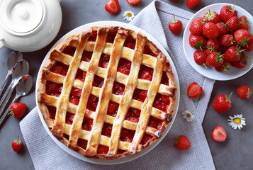 Delicious strawberry pie on table