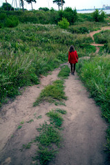 Road green grass person in red 