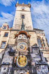 Prague astronomical clock tower at blue sky background. Vie from bottom.