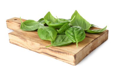 Pile of green fresh organic basil leaves isolated on white