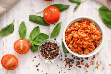 Meat sauce in ceramic bowl on kitchen table