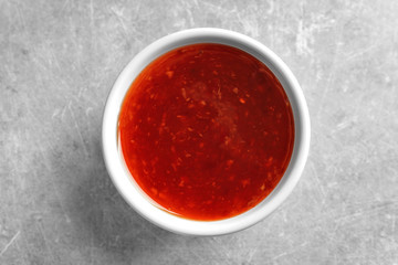 Chili sauce in bowl on table