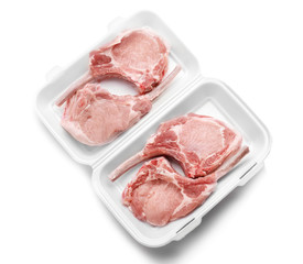 Raw ribs in container on white background