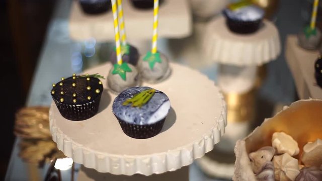 Cute candy bar with various candies and cakes.
