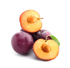 Fresh ripe plums on white background