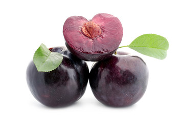 Fresh ripe plums on white background