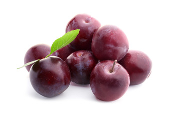 Fresh ripe plums on white background