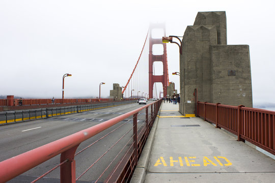 The Golden Gate Bridge, a painted red suspension bridge spanning the Golden Gate strait, the channel between San Francisco Bay and the Pacific Ocean