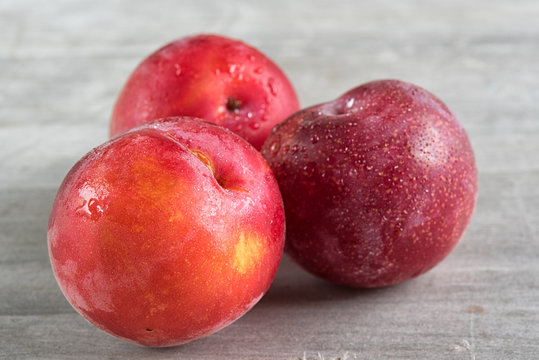 Apriums fruits in a basket over wooden background