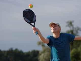 Man playing beach tennis