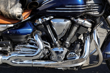 Closeup detail photo chrome engine and exhaust pipe of the motorcycle