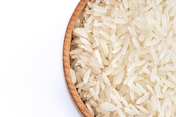 Healthy food. Wooden bowl filled parboiled rice on white background. Close up. Top view, high resolution product