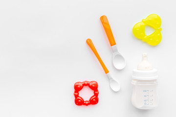 children feeding with breastmilk or infant formula powdered baby milk and toys on white background top view space for text