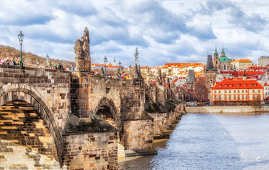 Prague Charles bridge, side view at Prague castle and old tower over Vltava river.