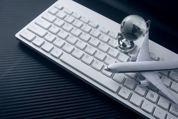 airplane with global world and keyboard in business vision concept